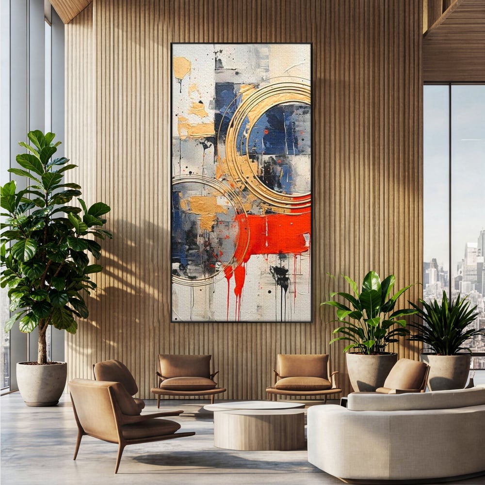 Tablou canvas cu tablou abstract cu cercuri aurii si tuse rosu aprins, in rama de aluminiu negru, pe perete intr-un birou
